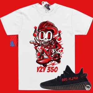 May include: White t-shirt with a red cartoon skeleton character skateboarding and the text "YZY 350". Black and red Yeezy 350 sneakers with the text "SPLY-350" on the side.