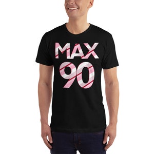 May include: Black t-shirt with a pink and white striped design that says "MAX 90".