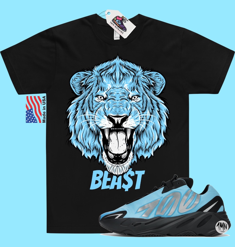 May include: Black t-shirt with a blue lion graphic and the word "BEAST" printed on it. A pair of blue and black sneakers with the number "700" printed on the side.