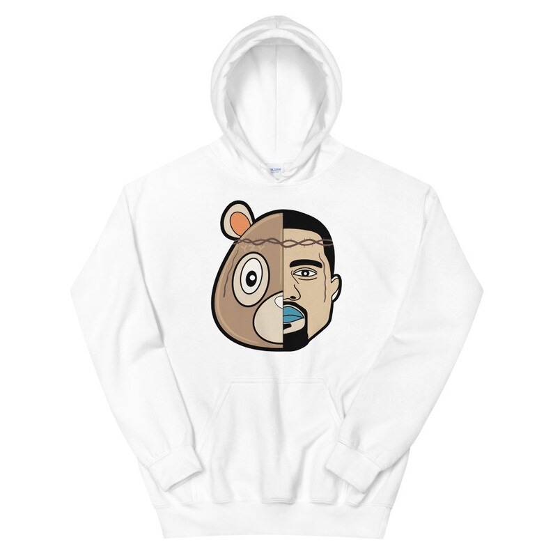 May include: White hoodie featuring a graphic of a brown bear head with a barbed wire crown and a man's face on the right side of the head.