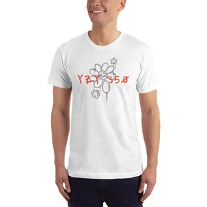 May include: White t-shirt with a gray flower graphic and the text "YZY 350" in red.