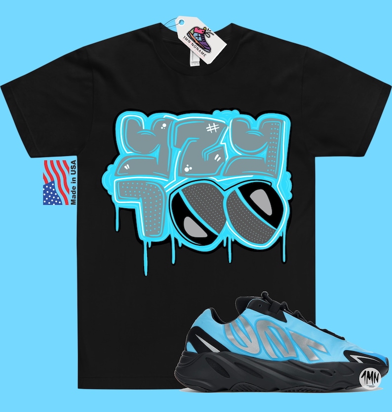 May include: Black t-shirt with a blue and gray graphic that says "Yeezy Too" with dripping paint. A pair of black and blue sneakers with a white logo.