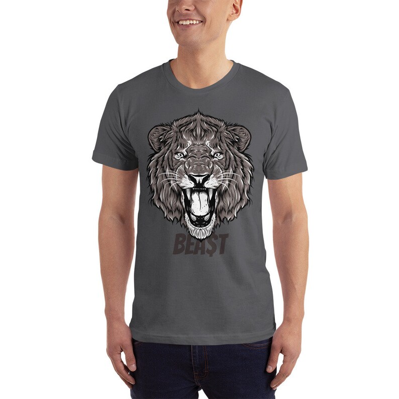 May include: A dark gray t-shirt with a graphic of a roaring lion's head and the word "BEAST" printed below it.