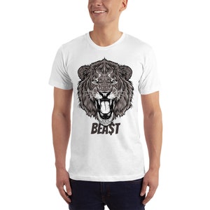 May include: White t-shirt with a black and white illustration of a lion's head with the word "BEAST" printed below it.