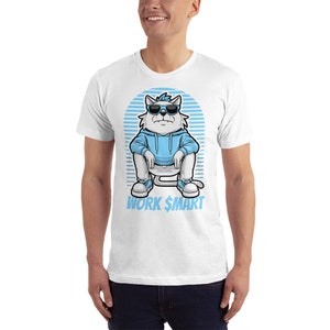 May include: White t-shirt featuring a cartoon cat wearing sunglasses and a blue hoodie. The cat is sitting with its legs crossed and the text "WORK $MART" is below the cat.