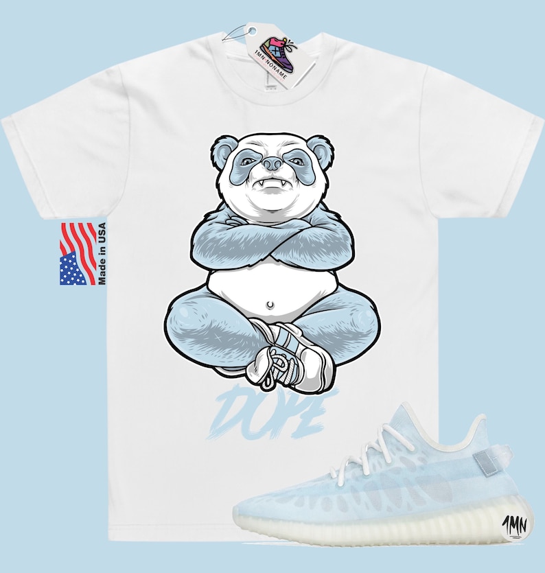 May include: White t-shirt featuring a blue panda illustration and the word "Dope" printed in blue. The t-shirt is paired with a light blue and white Yeezy Boost 350 V2 trainer.