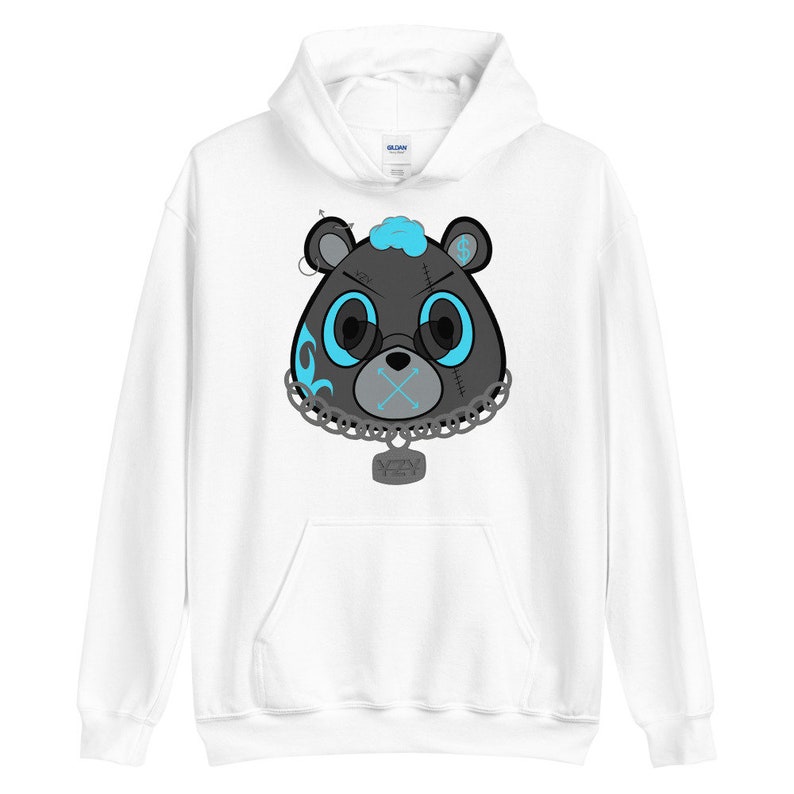 May include: White hoodie with a black and blue cartoon bear with a chain and a tag that says "YZY" on it.