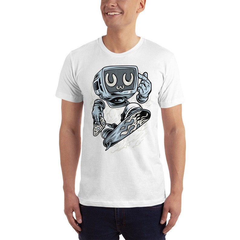 May include: White t-shirt with a graphic of a cartoon television character skateboarding. The character has a blue and gray color scheme and is wearing a white glove. The character is holding a video game controller in one hand and is making a 'peace' sign with the other hand. The character's eyes are wide open and have a 'kawaii' expression.