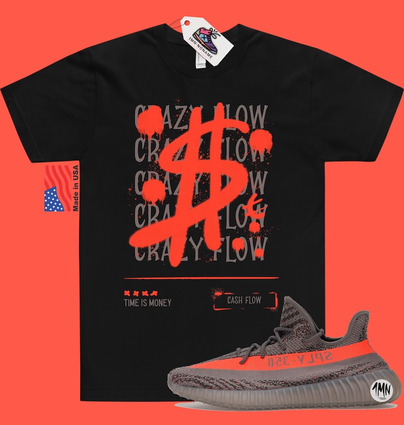 May include: Black t-shirt featuring a red dollar sign graphic and the text "Crazy Flow" repeated in grey. The shirt is paired with grey and orange trainers with the text "26ГА-320" on the side.