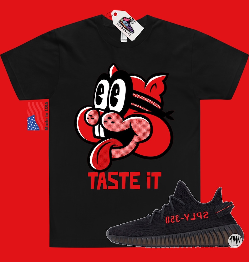 May include: Black t-shirt with a red cartoon character with the text "TASTE IT" and a pair of black and red sneakers with the text "YZY-350" on the side.