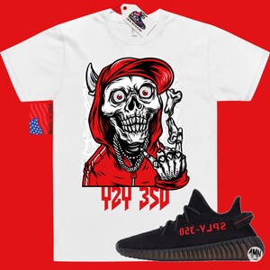 May include: White t-shirt with a red hooded skeleton graphic and the text "424 350". Black and red sneakers with the text "SPLY-350" on the side.