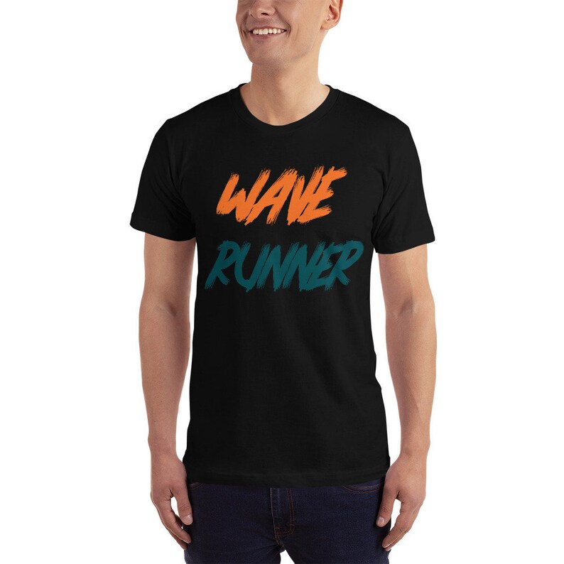 May include: Black t-shirt with the words "WAVE RUNNER" printed in orange and teal.