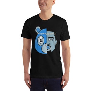 May include: Black t-shirt with a graphic of a blue bear head and a man's face, split down the middle. The bear has a crown of thorns on its head.