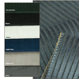 Swatch card beside denim blue ribbed velvet upholstery fabric, striped velvet fabric color options