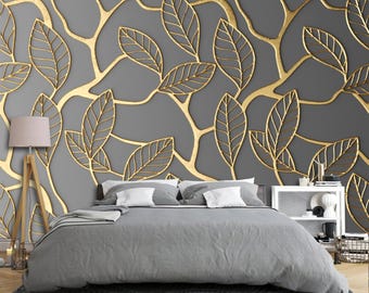 Mural de pared 3D con hojas y ramas amarillas sobre fondo gris.