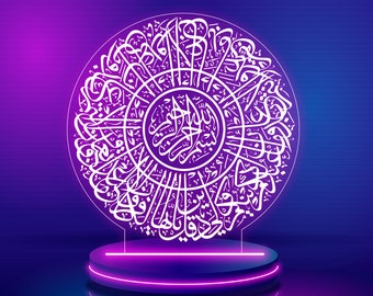 May include: A white neon sign with Arabic calligraphy in a circular design, on a purple and blue gradient background. The sign is on a purple platform with a glowing purple rim.