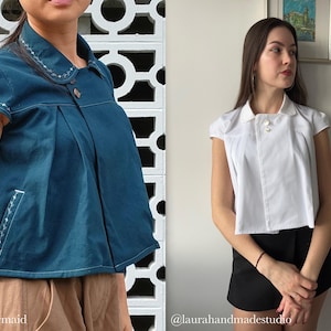 May include: Two short-sleeved blouses. One is teal with white embroidered details and a button closure. The other is white with a button closure. Both have a collared neckline. The teal blouse has the text "@sew.mermaid". The white blouse has the text "@laurahandmadestudio".