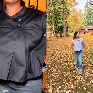 May include: A black, short-sleeved top with a collared neckline and two button closures. The top has a pleated design and a small pocket. The second image shows a person wearing a light blue top and jeans in a park.