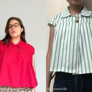 May include: Two short-sleeved tops are displayed. One is a vibrant red with a collar and button details. The other is white with vertical green stripes, also with a collar and button closure. Both tops have a vintage aesthetic.