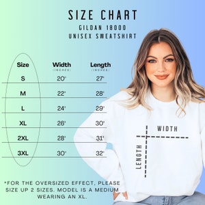 May include: Size chart for a Gildan 18000 unisex sweatshirt. The chart shows the width and length in inches for sizes S, M, L, XL, 2XL, and 3XL. The text "*FOR THE OVERSIZED EFFECT, PLEASE SIZE UP 2 SIZES. MODEL IS A MEDIUM WEARING AN XL." is at the bottom of the chart.
