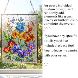 May include: A rectangular stained glass window hanging featuring a vibrant floral arrangement with yellow daffodils, red roses, blue delphiniums, and purple pansies. The panel includes small butterfly accents and text regarding custom design options.