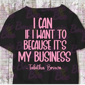 May include: Black t-shirt with pink text that reads "I can if I want to because it's my business - Tabitha Brown".