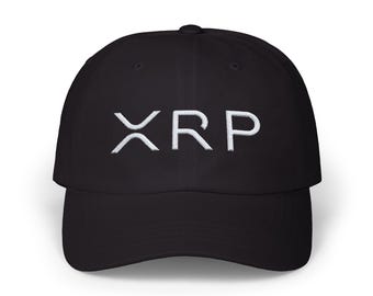 May include: Black baseball cap with the white embroidered letters "XRP" across the front. The cap has a curved brim and a rounded crown. The hat is made of a soft material.