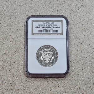 1966 SMS 50 Cents Kennedy Half Dollar 40% Silver Mint Error Coin "Reverse Struck Thru" NGC Slabbed & Graded At MS 67 Cameo