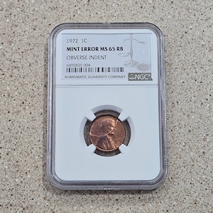 Vintage 1972 1C Lincoln Memorial Cent Penny Coin Mint Error Obverse Indent NGC Slabbed & Graded At MS 65 RB- Rare Mint Error Penny Coin