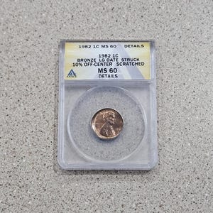 1982 1C Lincoln Memorial Cent Penny Bronze Coin MINT ERROR ANACS Slabbed & Graded At Large Date Struck 10% Off Center Scratched MS60 Details