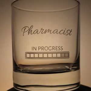 May include: A clear glass tumbler with the text "Pharmacist in Progress" and a progress bar graphic.