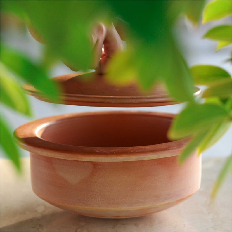 clay pot 
clay pot for cooking
clay cookware
swadeshi blessings
clay cooking pot
indian cookware
traditional cooking
clay pots
clay cookingpots with lid
pot
handi
claypots for cooking with spoon
indian kadai
claypan
clay biryani pot
Frying pan