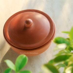 clay pot 
clay pot for cooking
clay cookware
swadeshi blessings
clay cooking pot
indian cookware
traditional cooking
clay pots
clay cookingpots with lid
pot
handi
claypots for cooking with spoon
indian kadai
claypan
clay biryani pot
Frying pan
