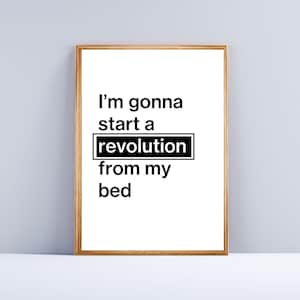 May include: A framed print with a white background and black text that reads "I'm gonna start a revolution from my bed."