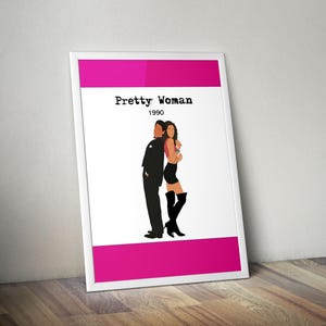 May include: Framed poster with a minimalist illustration of the film "Pretty Woman" from 1990. The design features a pink and white background, the title and year in black text, and silhouettes of the two main characters.