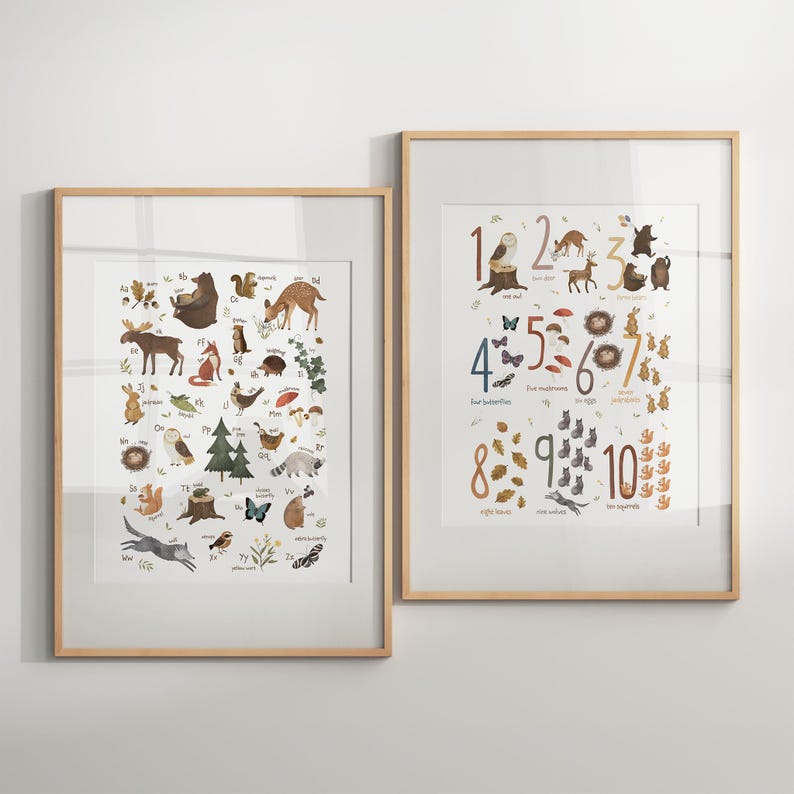 May include: Two framed prints with illustrations of animals and numbers. The print on the left features a colorful alphabet with animals from the forest. The print on the right features numbers 1-10 with illustrations of forest animals and objects.