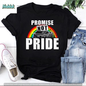 May include: Black t-shirt with a rainbow and a white ark with the text "PROMISE NOT PRIDE" in white.
