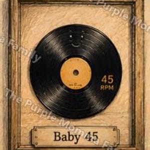 May include: A framed wall art piece featuring a black vinyl record with a yellow center label. The record is marked with 45 RPM. Below the record, a rectangular plaque is mounted on the frame with the text Baby 45 printed in black.