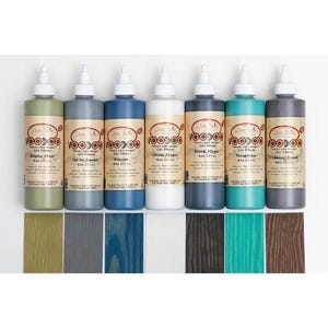 May include: Eight bottles of gel stain in various colors, including Bayou Moss, Up In Smoke, Denim, White Magic, Black Magic, Temptress, Tobacco Road. Each bottle is labeled "Voodoo Gel Stain" and contains 8 oz (237 ml) of stain.