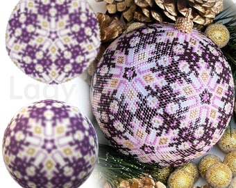 May include: Purple and white beaded snowflake ornament with a gold top. The ornament is made with peyote stitch and has a 3D ball shape. The ornament is surrounded by pine cones and other decorative elements.