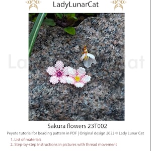 May include: Two pink and white beaded sakura flowers with yellow and purple centers, on a gray rock background. The image includes the text "Sakura flowers 23T002 Peyote tutorial for beading pattern in PDF | Original design 2023 &copy; Lady Lunar Cat 1. List of materials 2. Step-by-step instructions in pictures with thread movement"