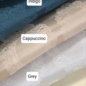 May include: Three fabric swatches with a white damask pattern. The top swatch is indigo blue, the middle swatch is cappuccino, and the bottom swatch is grey.