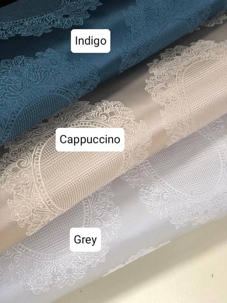 May include: Three fabric swatches with a white damask pattern. The top swatch is indigo blue, the middle swatch is cappuccino, and the bottom swatch is grey.