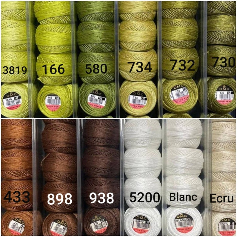 May include: Close-up of spools of embroidery floss in various shades of green, brown, white, and beige. The spools are labeled with DMC numbers, including 3819, 166, 580, 734, 732, 730, 433, 898, 938, 5200, Blanc, and Ecru.