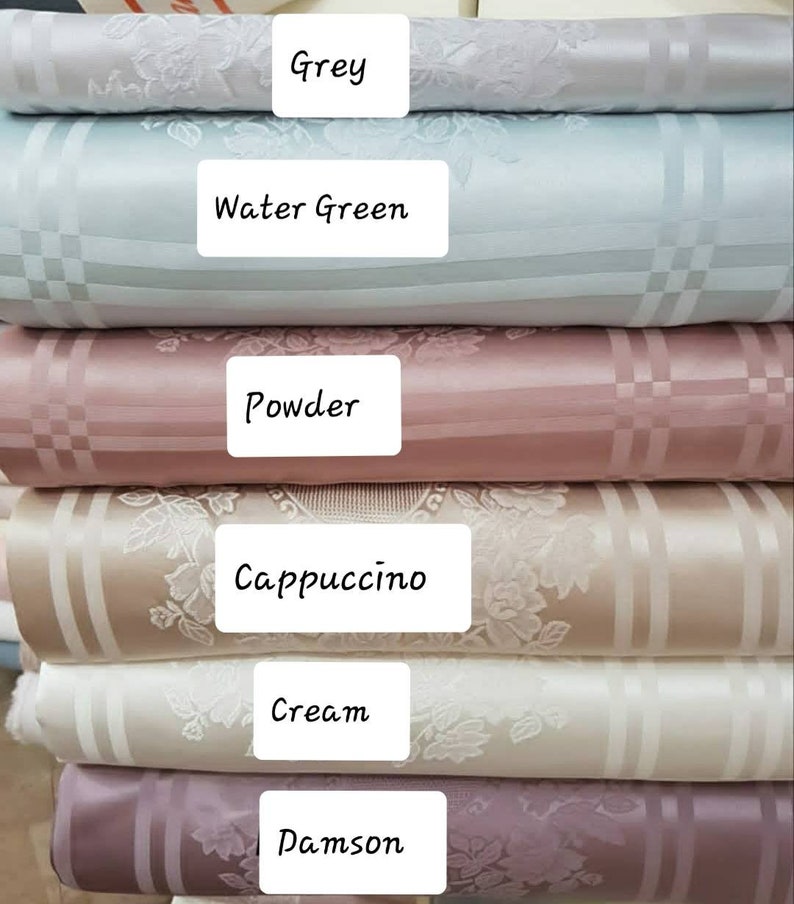 May include: Six fabric swatches in different colors and patterns. The swatches are stacked on top of each other. The colors are grey, water green, powder, cappuccino, cream, and damson.