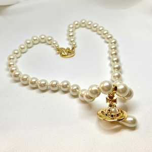 Gold pearl orb choker necklace