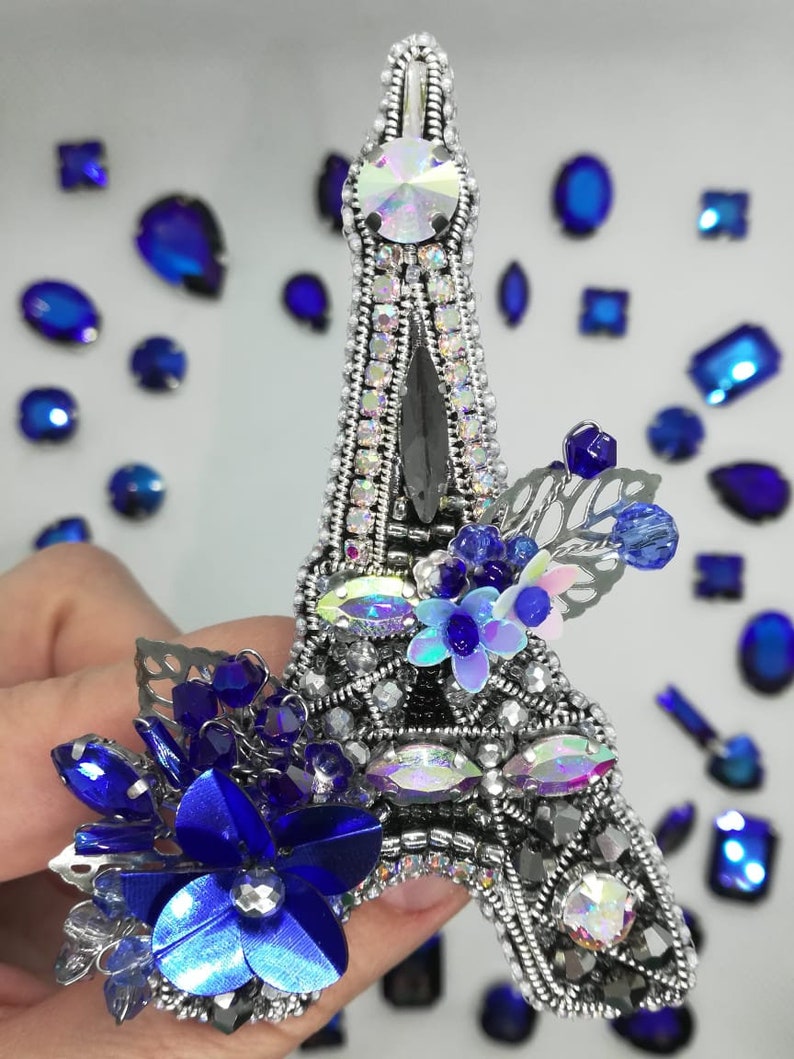 The Eiffel Tower The brooch is a tower made of beads The tower is handmade.