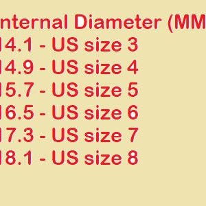 May include: A light yellow informational chart with red text listing ring internal diameters in millimeters alongside corresponding US sizes from 3 to 8. The text reads: Internal Diameter (MM), 14.1 - US size 3, 14.9 - US size 4, 15.7 - US size 5, 16.5 - US size 6, 17.3 - US size 7, 18.1 - US size 8.