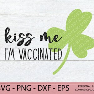May include: A black and white graphic design with a shamrock and the text "kiss me I'm vaccinated".