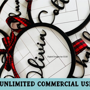 May include: Circular wooden ornaments with black frames and white interiors, featuring names in cursive script. Each ornament is adorned with a red and black plaid ribbon. The image includes the text "UNLIMITED COMMERCIAL USE".